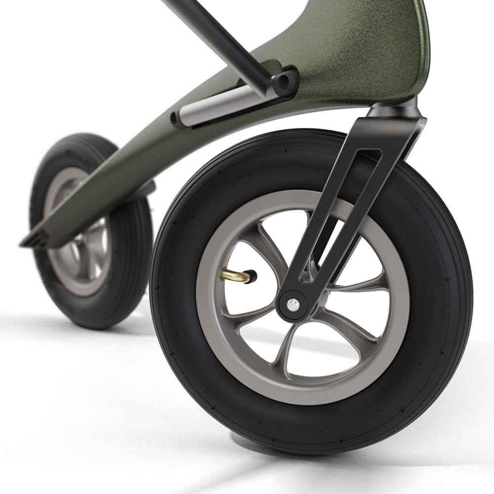 Close up of the large air filled wheel on the byACRE Carbon Overland rollator in Defender Green